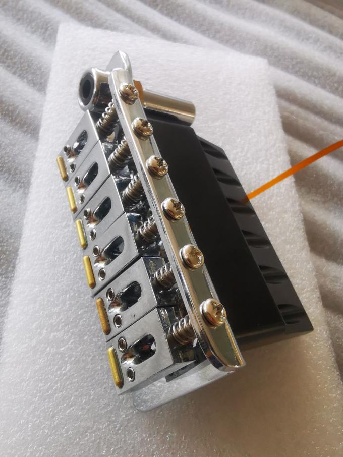 Guitar piezoelectric bridge power bridge